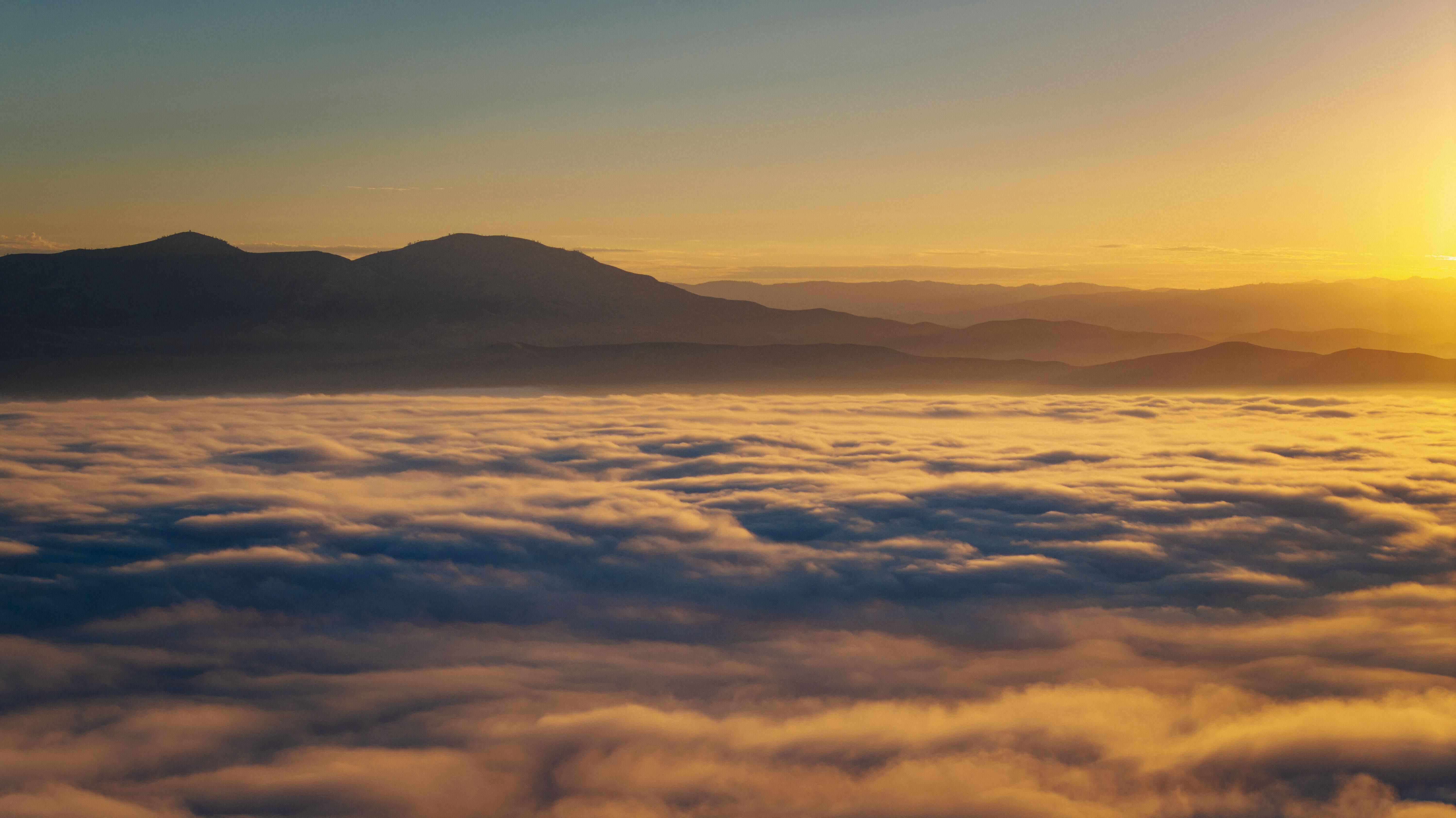 Thick marine fog looming over Monterey County at sunrise